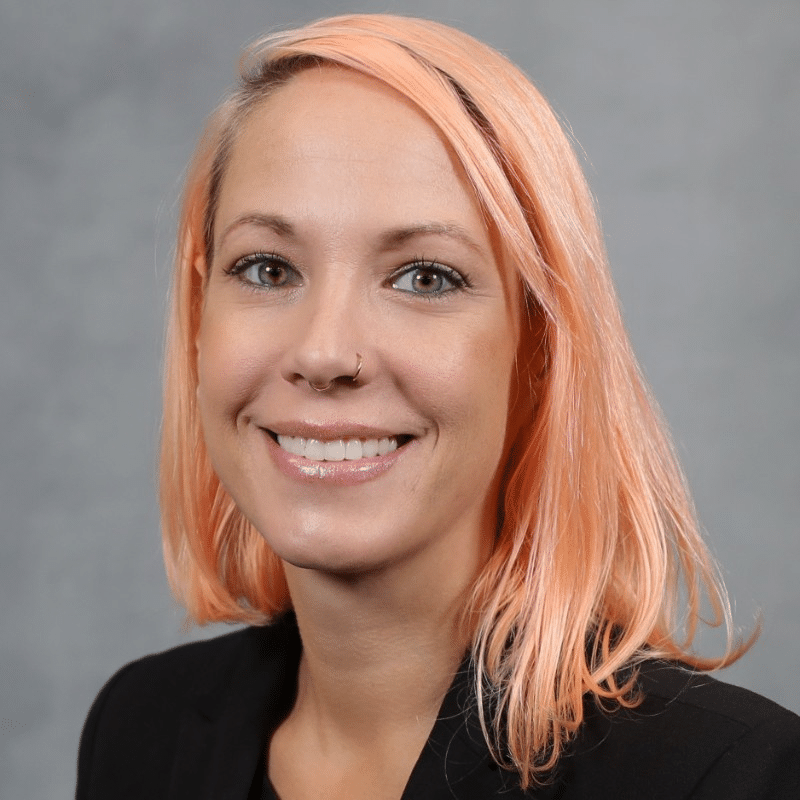 headshot of woman with orange-y hair
