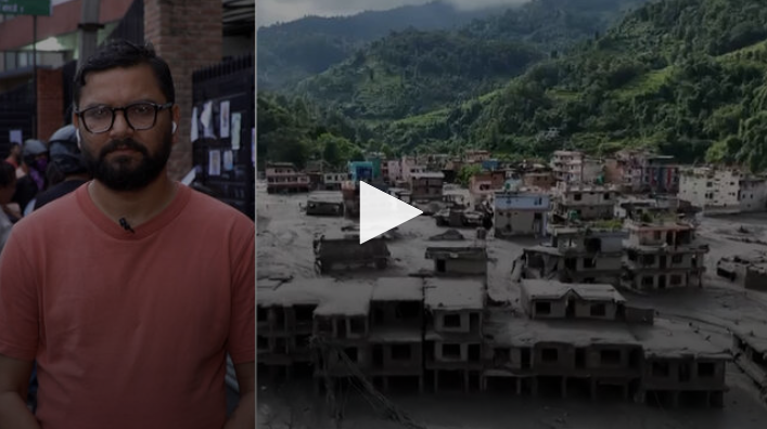 Man outdoors in red shirt at left, village in mountains at right with play button at center